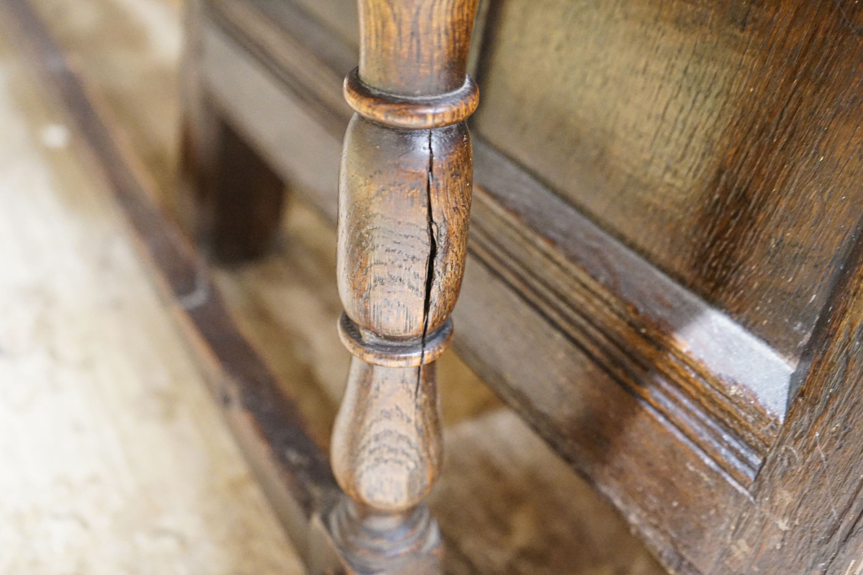 A 17th century style oak long stool, with solid seat on turned legs, length 119cm, depth 28cm, height 53cm